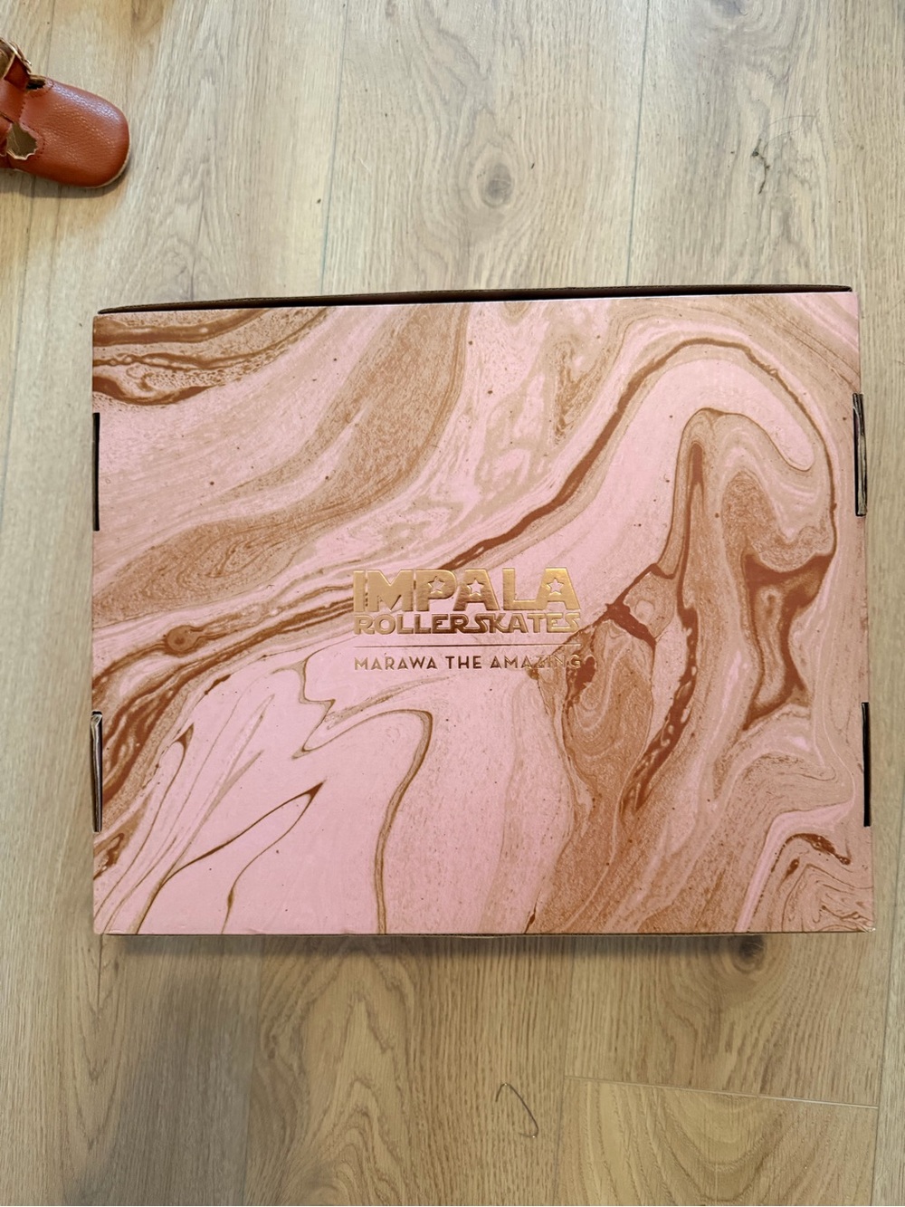 Impala rose gold roller skates